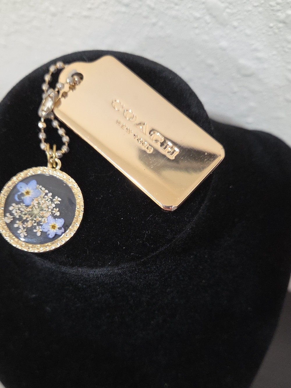 Coach Gold-Tone Hang Tag with Blue Flowers